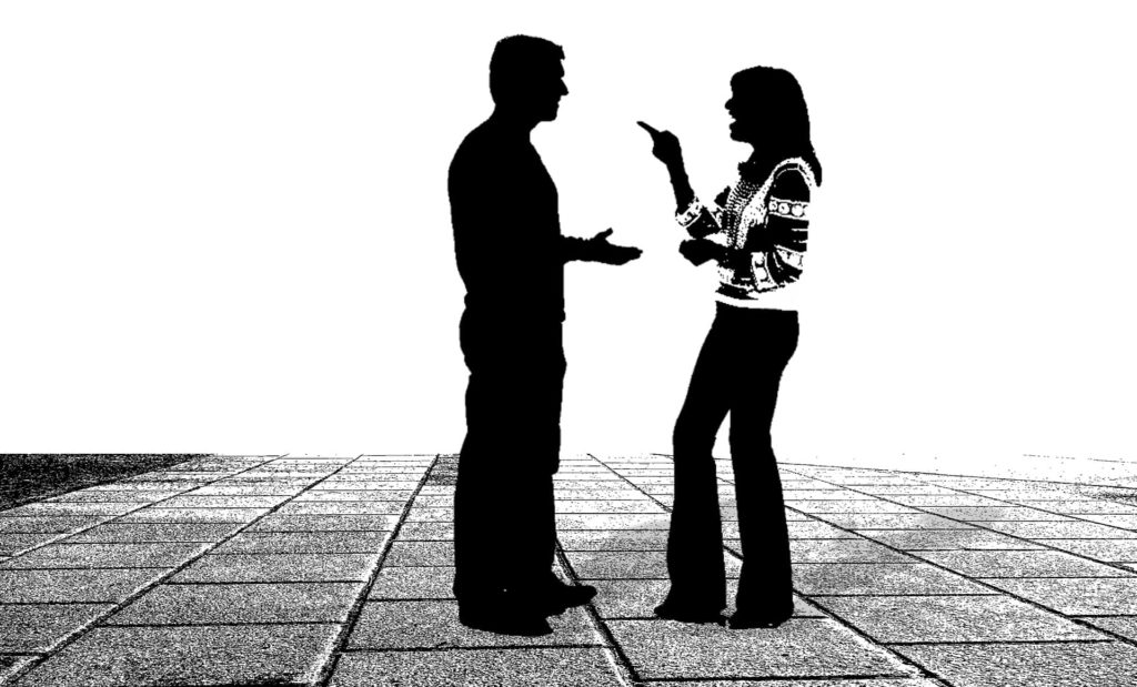 A silhouette of a man and woman arguing