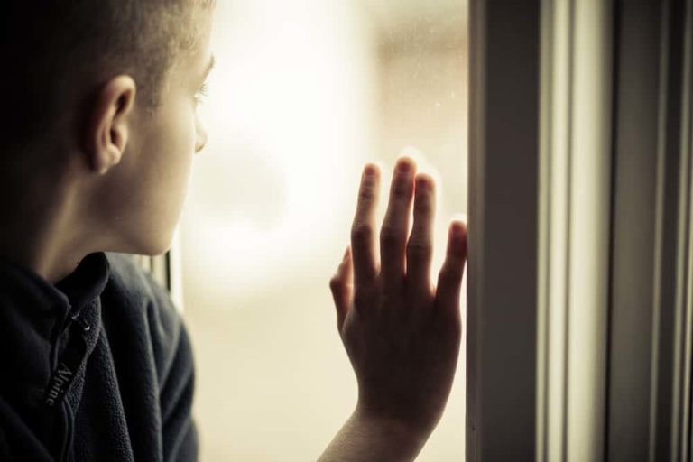 lonely guy looks out window