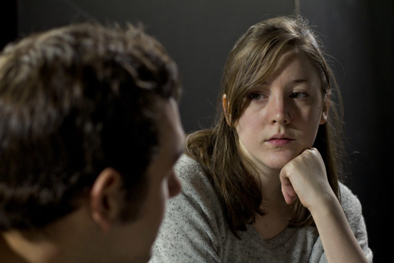 A compassionate counselor listens attentively.