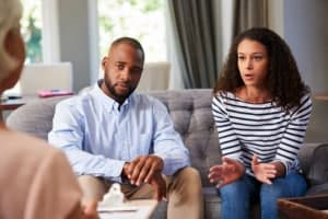 Couple in marriage counseling. Female is talking