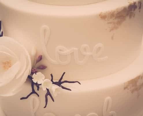 Wedding cake with "Love" written on it