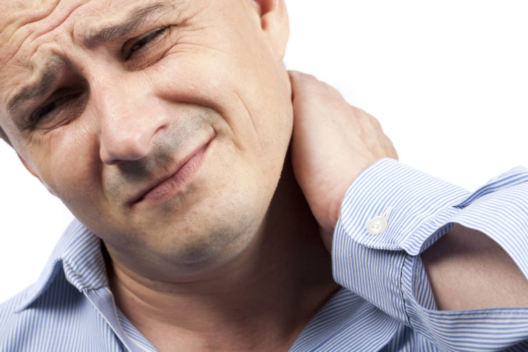 Man experiencing neck pain, seeking relief through therapy.