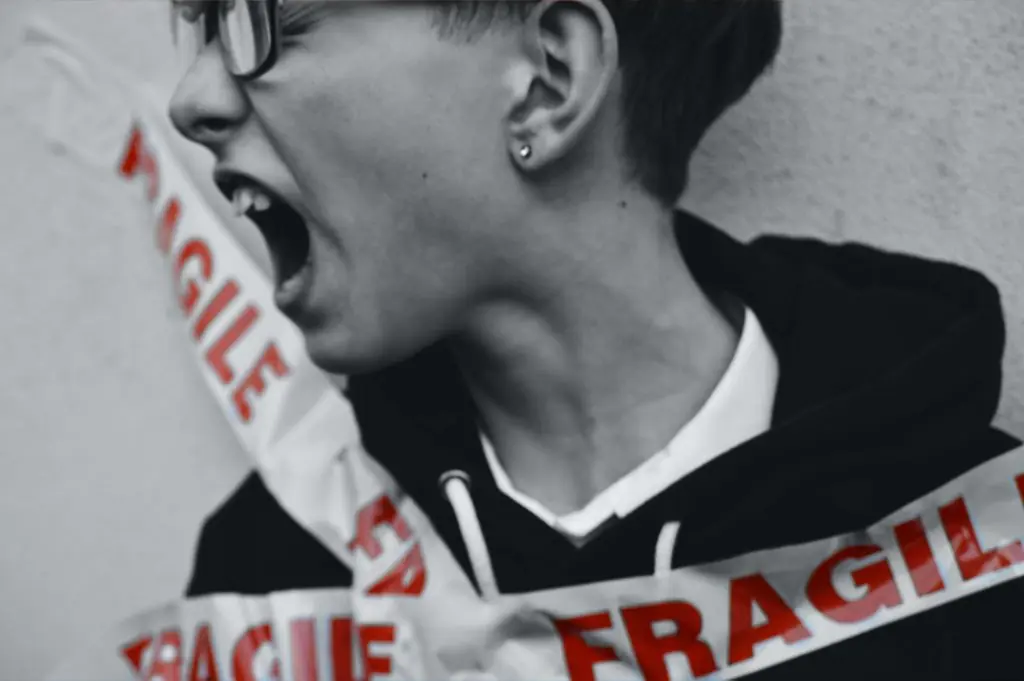 Person expressing stress, with "Fragile" tape, symbolizing a highly sensitive personality.